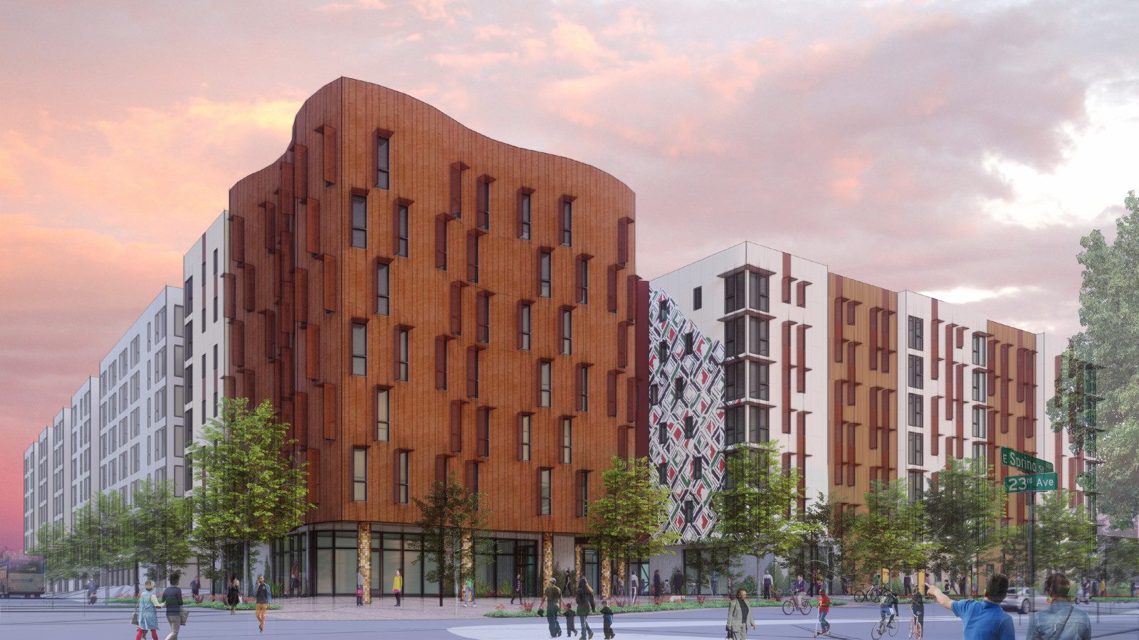 A digital rendering of the final concept for the Africatown Plaza building. The left side of the building features an undulating facade with a rusted steel exterior. The right side of the building is rectangular with long vertical windows and a mural. There is a community plaza in front of the building.