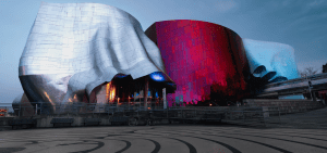 A view of MoPOP's exterior at dusk
